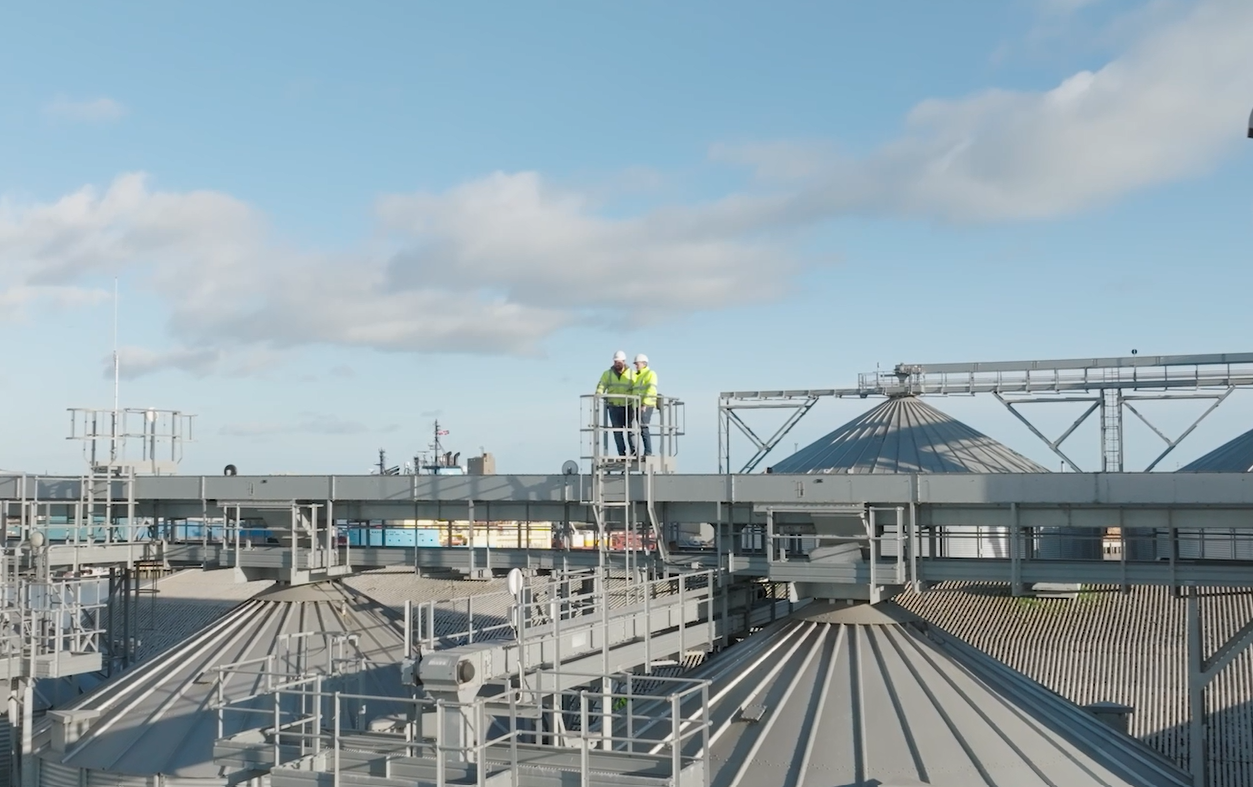 two men working on silos